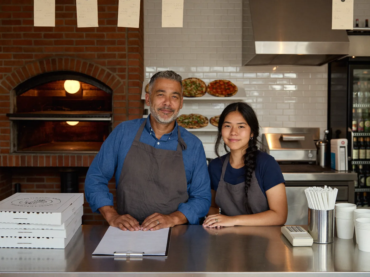 Pizzeria counter before AIO: plain boxes and no branding